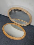 Two oval pine framed mirrors