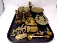 A tray containing antique and later brass ware to include candlesticks,