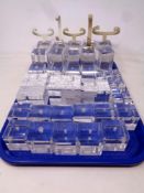 Thirty-five Omega perspex watch display stands bearing name and logo with watch holders.