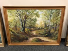 Continental school : A track through woodland, oil on canvas, 96 cm x 66 cm.