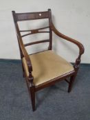 A reproduction mahogany carver chair with dralon seat