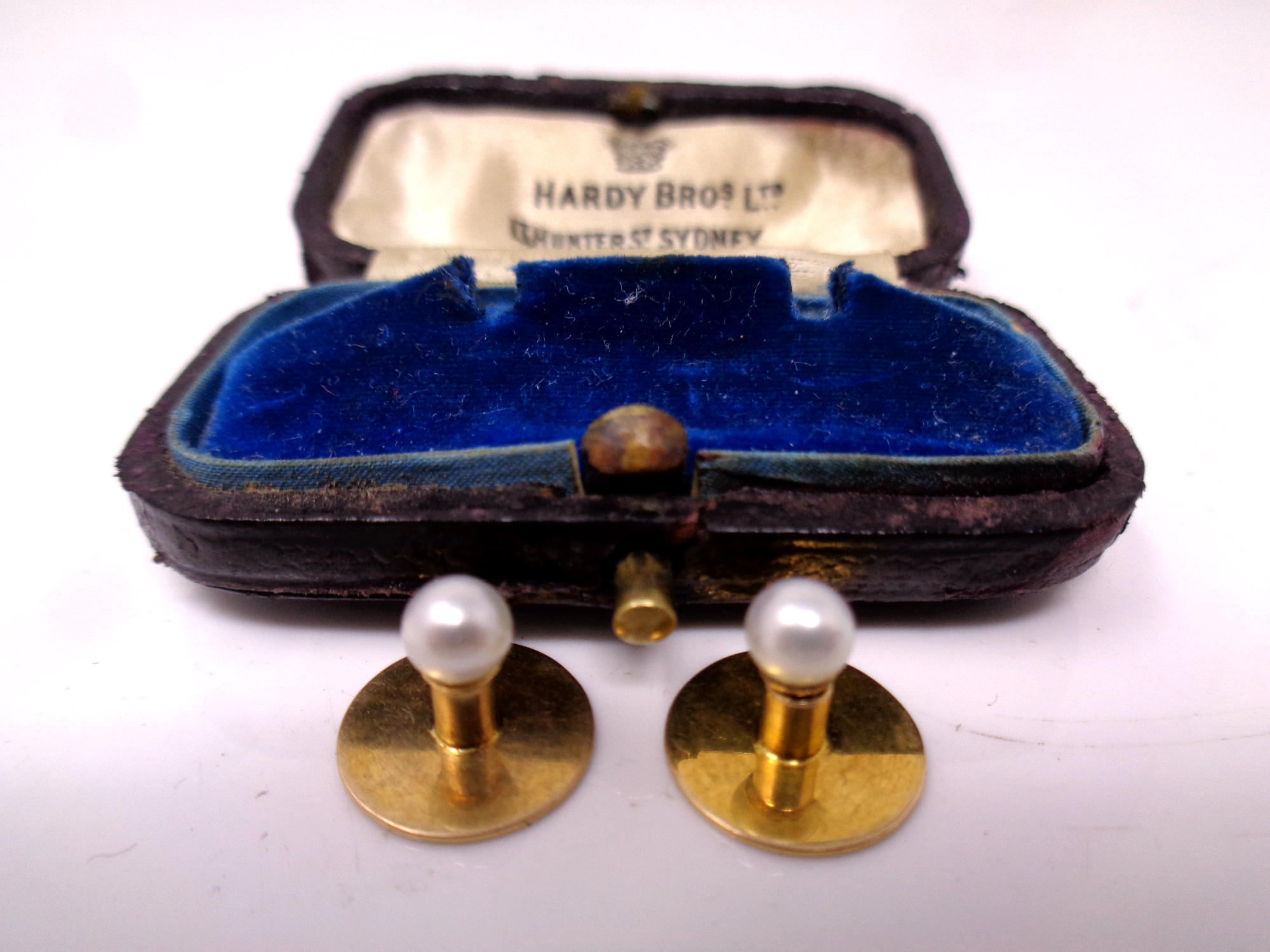 A pair of 15ct gold cultured pearl dress studs