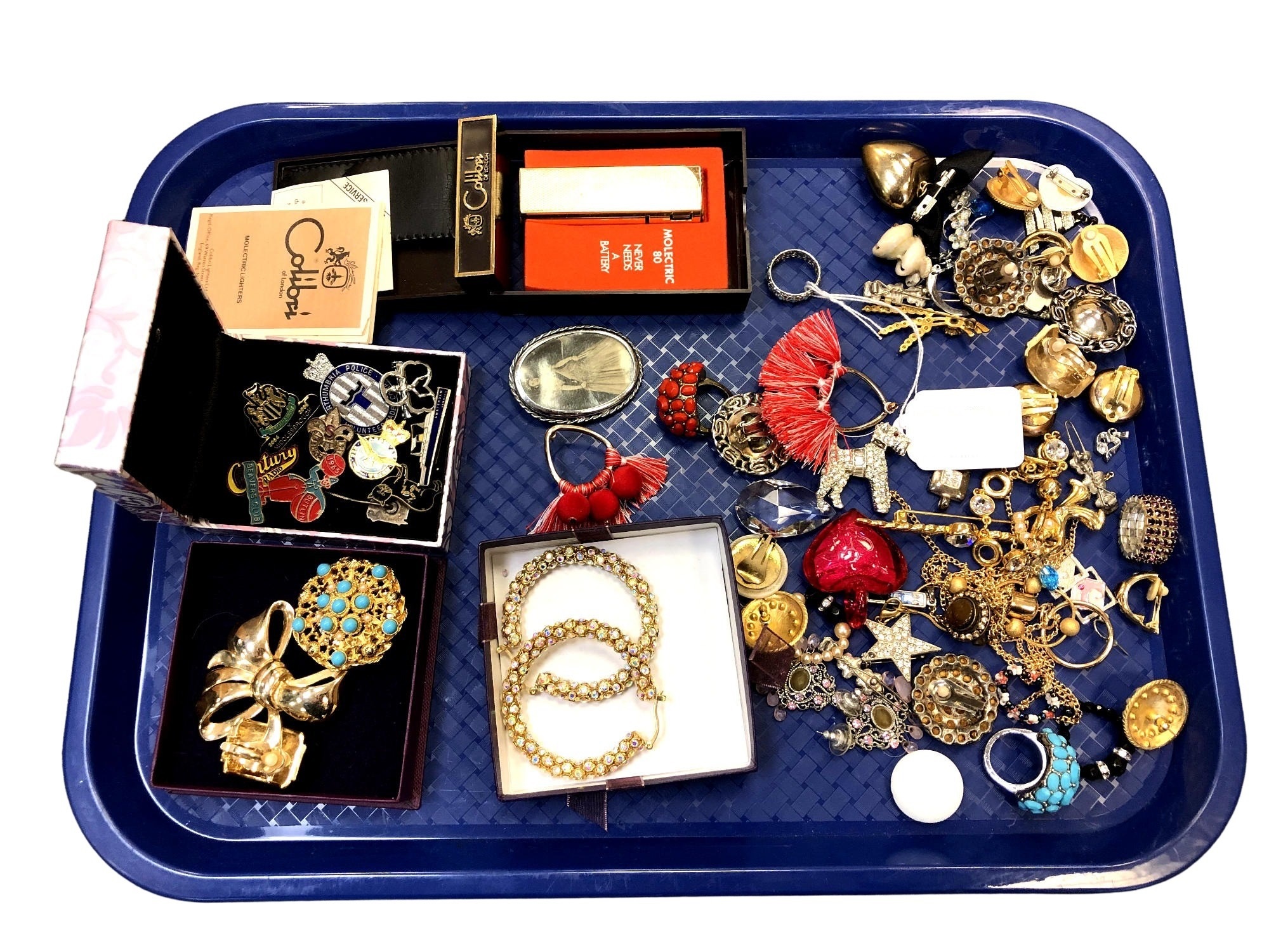 A collection of costume jewellery, Calibri lighter in box with original instructions, badges etc.