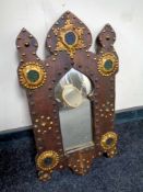 A stained pine Moroccan style wall mirror