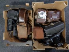 Two boxes containing vintage cameras and cine cameras