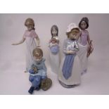 Five Nao figures to include Girl with puppy, Girl with Violin, Girl with doll,