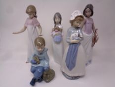 Five Nao figures to include Girl with puppy, Girl with Violin, Girl with doll,
