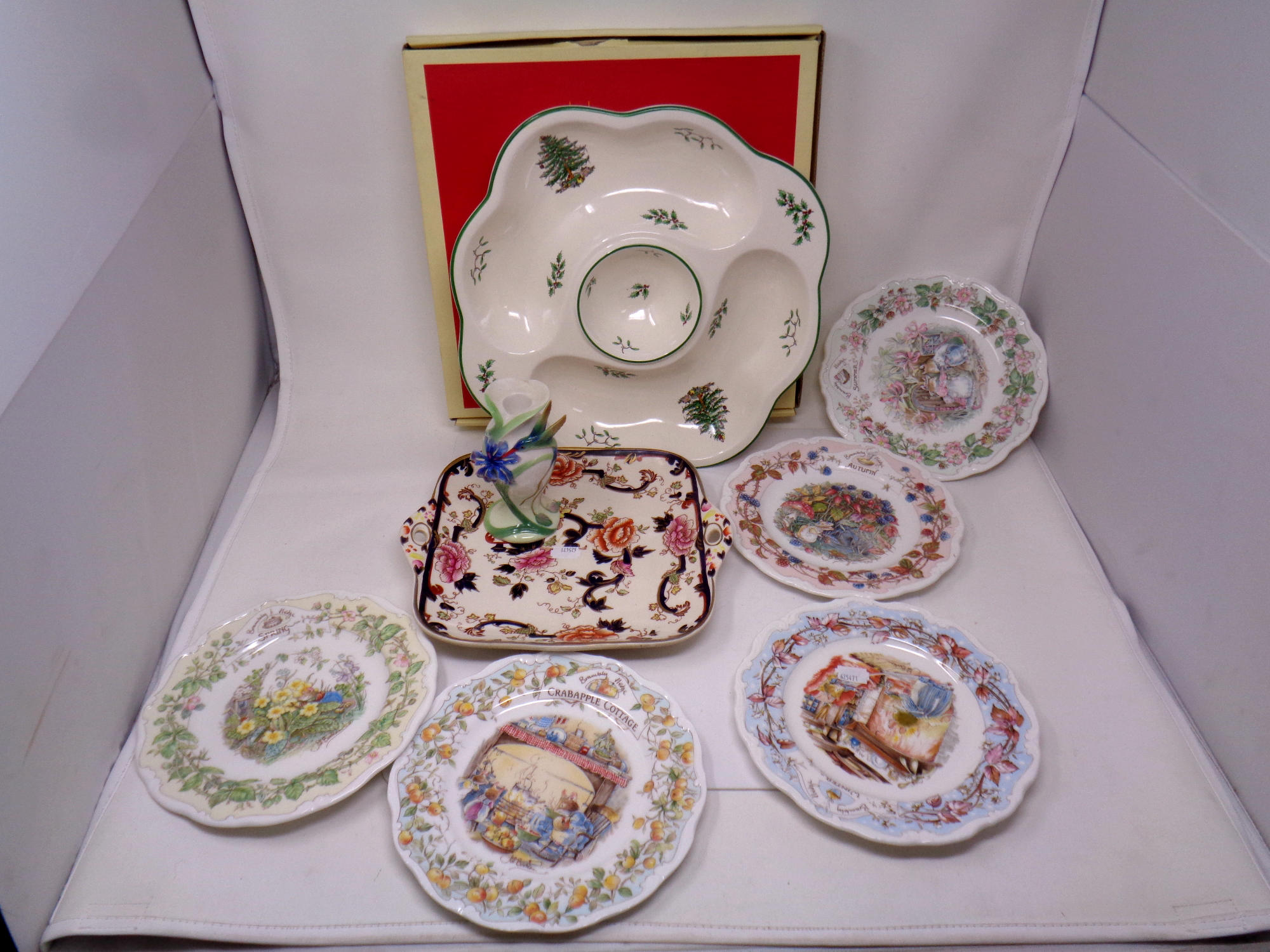 A tray containing a boxed Spode Christmas serving dish, Brambley Hedge plates, Masons plate,