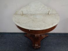 A Victorian mahogany demi-lune marble topped wash stand