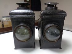 A pair of vintage railway lamps.