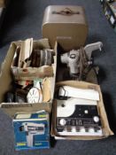 A Bell & Howell projector in case together with a further super 8 projector, film reels,