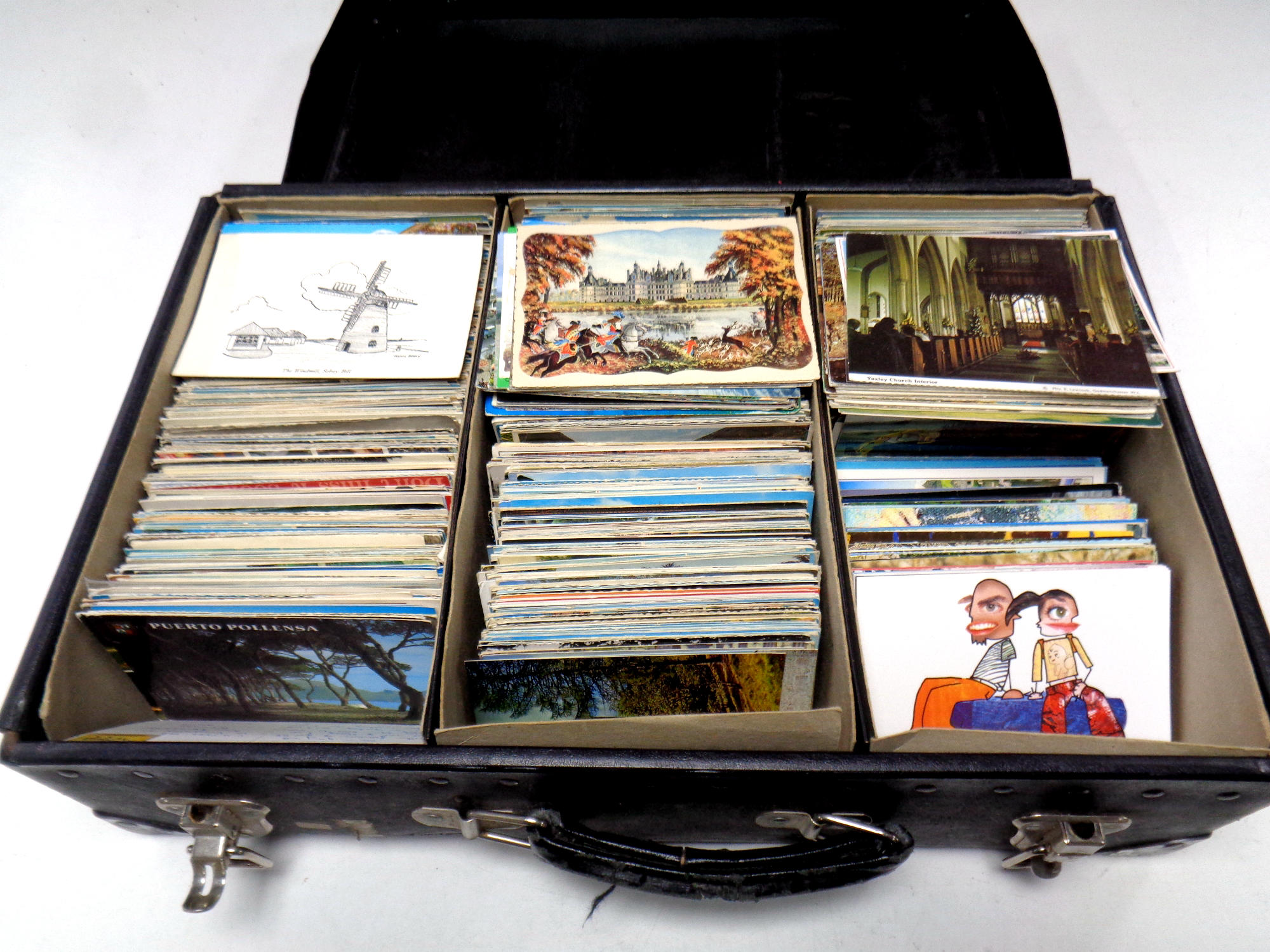 A suitcase containing a vast quantity of 20th century postcards to include continental and tourist