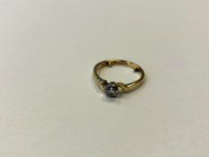 An 18ct gold and platinum solitaire diamond ring, size I CONDITION REPORT: 2.