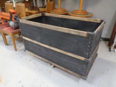 A wooden bound cart on casters