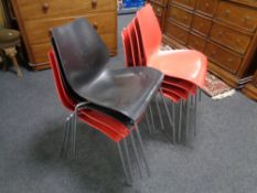A set of eight Kartell Maui dining chairs on metal legs (6 red 2 black)