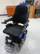 A Quickie Salsa power assisted wheelchair with charger,
