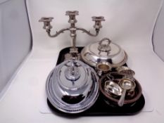 A tray containing antique and later plated wares to include three-way table candelabrum,