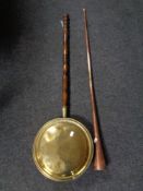 An antique copper and brass hunting horn together with a copper beech handled bed warming pan