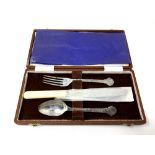 A Lindisfarne silver fork, spoon and stainless steel-bladed knife, boxed.
