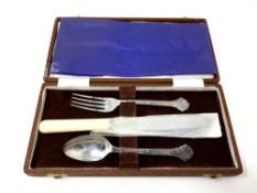 A Lindisfarne silver fork, spoon and stainless steel-bladed knife, boxed.