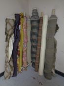 Ten rolls of assorted upholsterers fabric