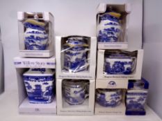 A tray containing eight Ringtons Willow patterned jugs, teapots, caddies, vase etc (boxed).