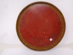 A circular Japanese lacquered tray, diameter 26.