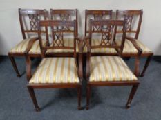 A set of six mahogany Regency style dining chairs comprising of two carvers and four singles