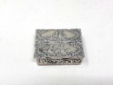 A silver pill box embossed with putti CONDITION REPORT: 26g