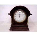 An antique mahogany and brass cased mantel clock retailed by Bravington Ludgate Hill, Kings Cross.