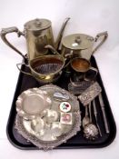 A tray containing assorted plated wares to include tea ware, napkin rings, tray,