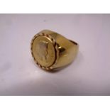 A gent's gilt metal coin ring.