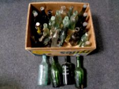 A box containing a large quantity of antique and later glass bottles