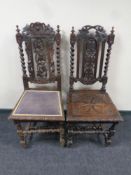 Two heavily carved oak barley twist chairs