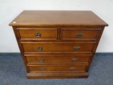 A five drawer chest in a mahogany finish