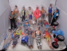 A box containing a large quantity of action men with clothes and accessories