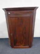 A 19th century hanging corner cabinet