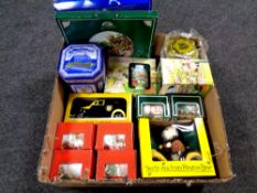 A box containing boxed Ringtons ceramics to include wall plates, mugs, teddy bear, money boxes,