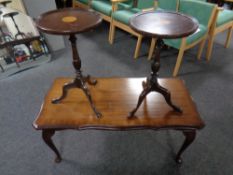 A pair of inlaid mahogany wine tables together with a shaped coffee table in a mahogany finish