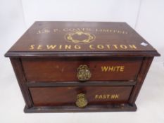 An Edwardian mahogany counter top two drawer chest bearing J and P Coats Ltd sewing cotton