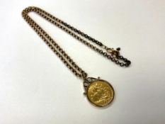 A Victorian half sovereign 1899 in 9ct gold mount on chain CONDITION REPORT: N.B.