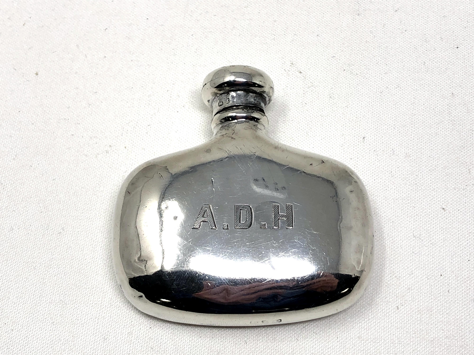 A small silver bottle/flask,