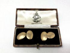 A pair of 9ct gold oval cuff links CONDITION REPORT: 6.