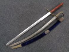 A reproduction Indian sword in scabbard and a Medieval style sword
