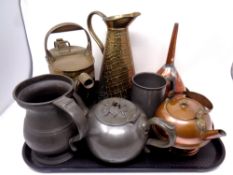 A tray containing 19th century and later metal wares to include pewter tea pot, tankard and jug,