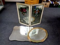 An antique twin hand painted framed mirror together with a further frameless mirror and a green and