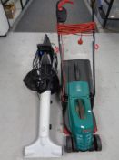 A Bosch Rotak 320 ER electric lawn mower together with a Macalister garden vacuum