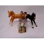 A Beswick Beatrix Potter figure, Hunca Munca sweeping together with two further Beswick figures,