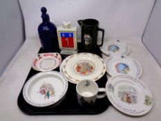 A tray containing assorted ceramics to include Wedgwood Peter Rabbit baby bowls, plates and cups,