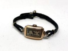 A lady's vintage 9ct gold rectangular curved wristwatch